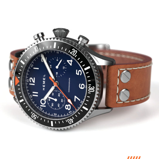 Hemel HFT20 chronograph with navy dial, brushed stainless steel case, black rotating bezel, and brown leather strap.