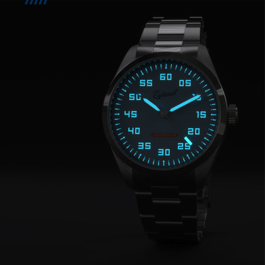 Eylandt Nitro automatic watch with black luminous dial, brushed stainless steel case, and brushed stainless steel bracelet.