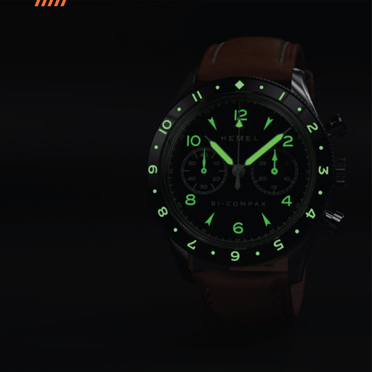 Hemel Air Wing chronograph with glowing green numerals on a black dial, black case, and brown leather strap.